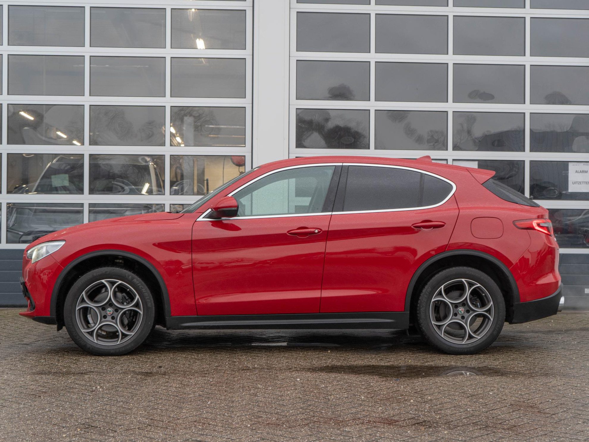 Alfa Romeo Stelvio 2.0 Turbo Aut. AWD 280pk First Edition | Rosso Alfa | 20” LM | Navi | Clima | Stoel-/Stuurverwarming