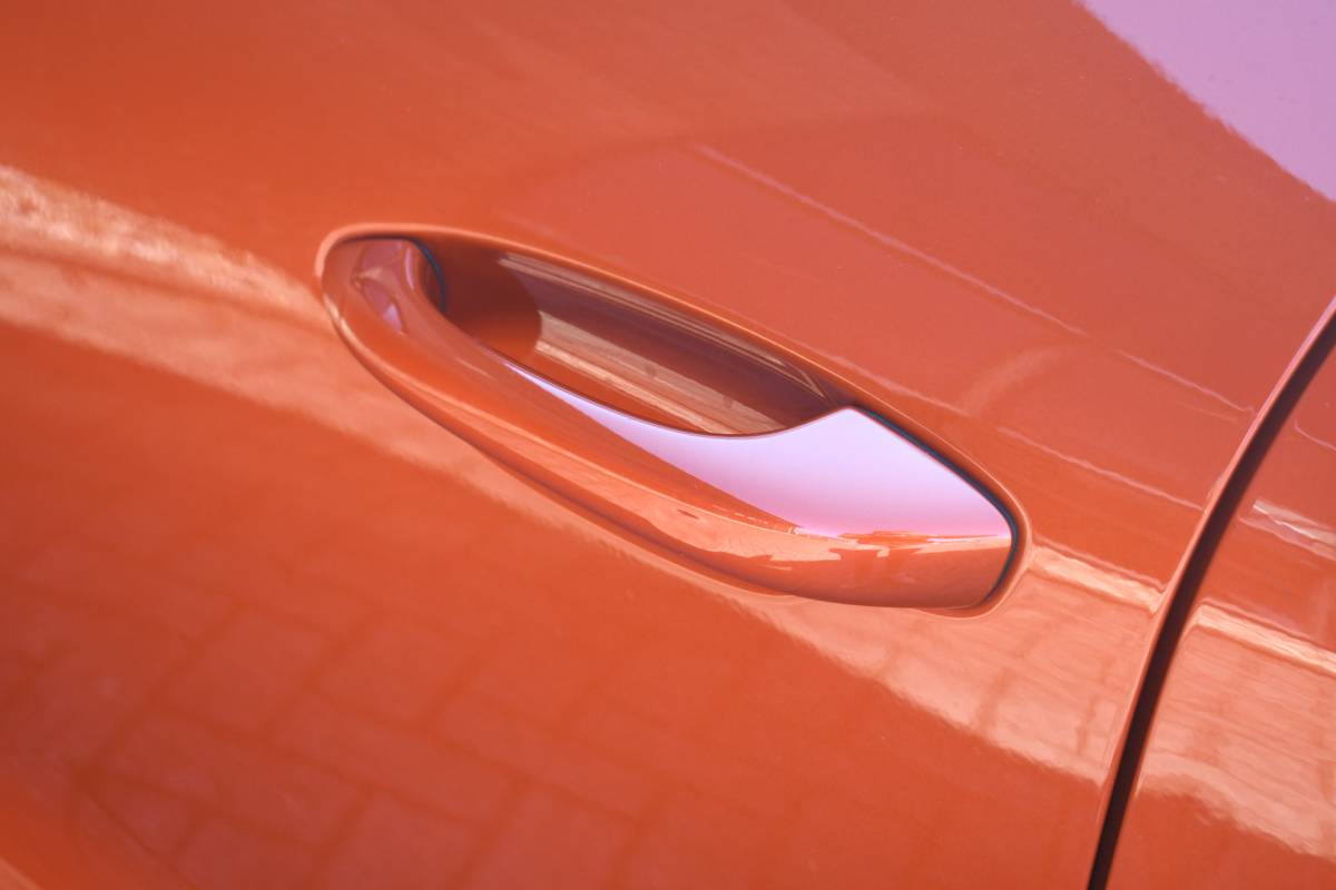 Porsche Macan Porsche Macan T 2.0 PDK Pano Luchtvering ACC Bose Papaya-orange