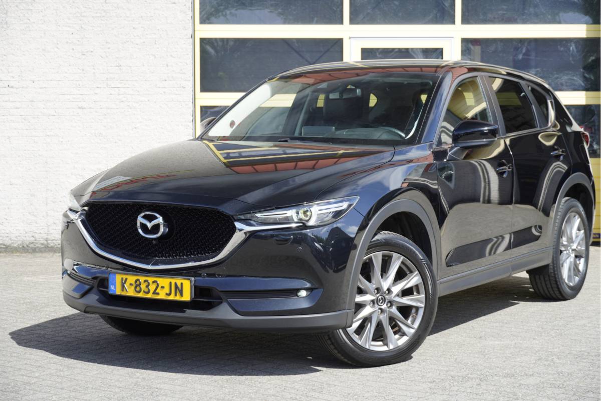 Mazda CX-5 Mazda CX-5 2.0 SkyActiv-G 165PK! Automaat Style Selected BJ2021 Lmv 19″ | Led V+A | Pdc | Keyless entry | 360° Camera |  Bose Audio | Head-up display | Climate control | Cruise control | Elek voorstoelen | Lederen bekleding | Verwarmd stuur | Verwarmde voorstoelen