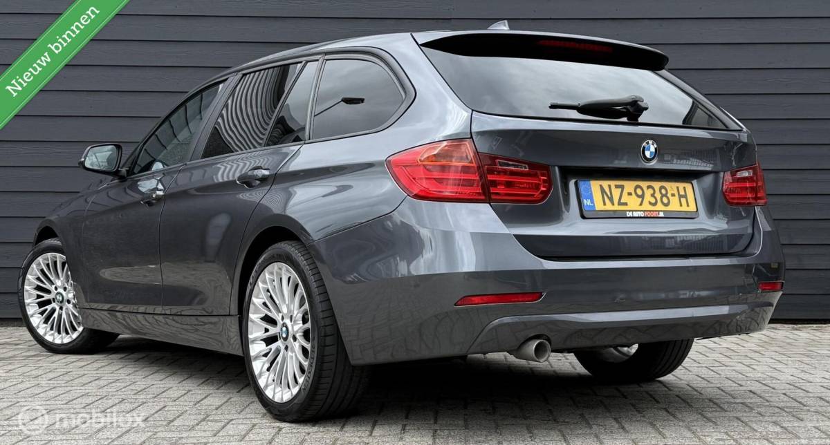 BMW 3 Serie BMW 3-serie Touring 318d High Executive Leder/Navi/Cruise