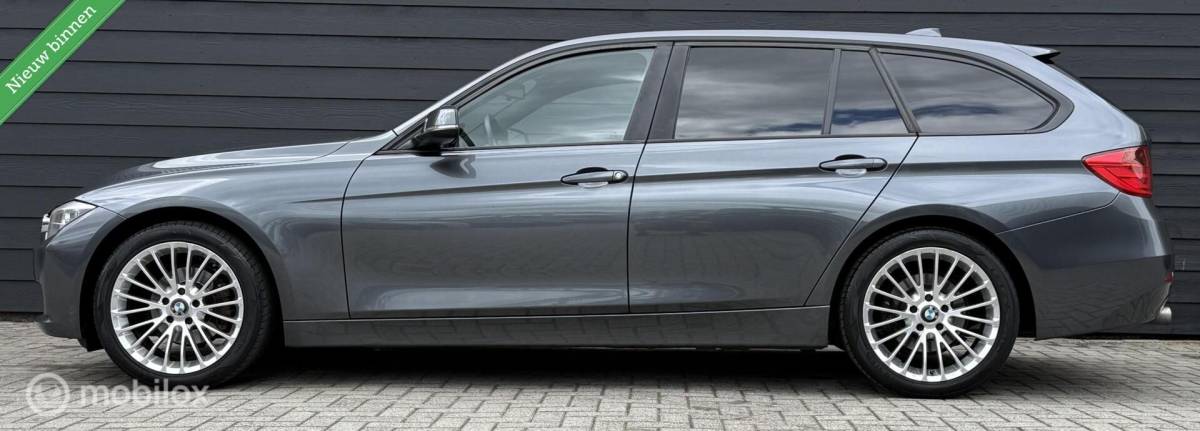 BMW 3 Serie BMW 3-serie Touring 318d High Executive Leder/Navi/Cruise