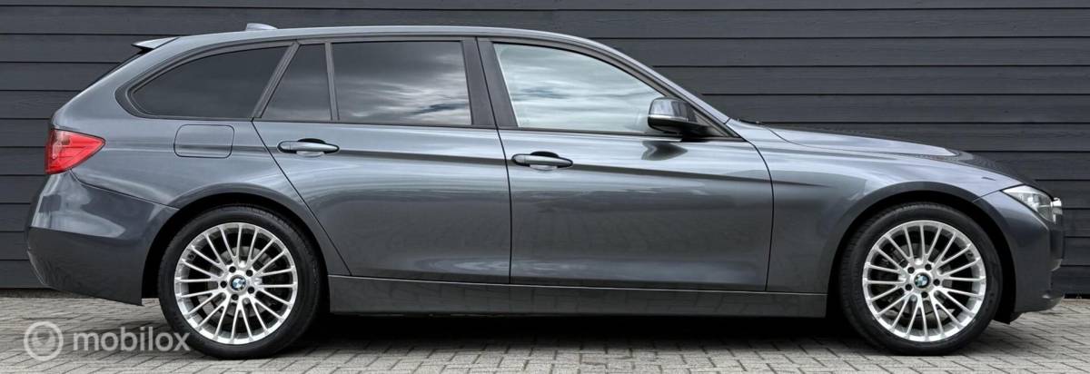 BMW 3 Serie BMW 3-serie Touring 318d High Executive Leder/Navi/Cruise