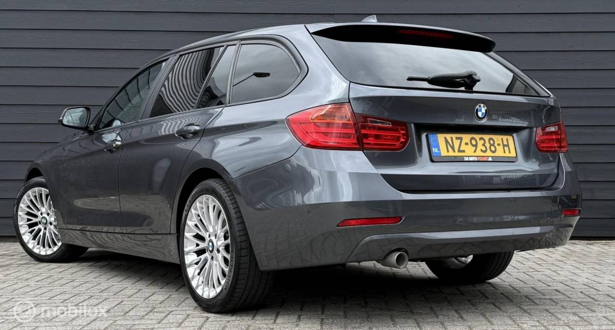 BMW 3 Serie BMW 3-serie Touring 318d High Executive Leder/Navi/Cruise