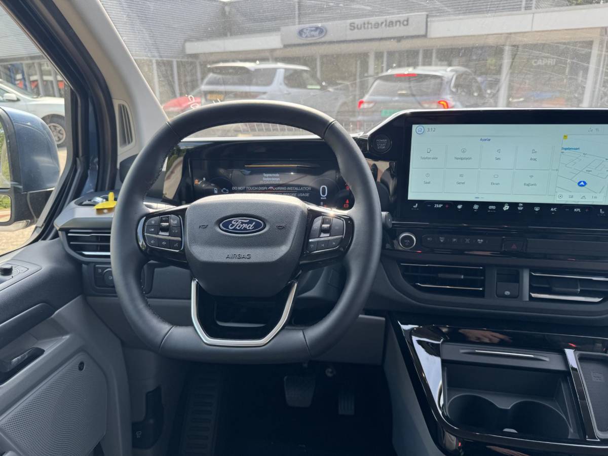 Ford Tourneo Custom Ford Tourneo Custom 340 2.5 PHEV L2H1 Titanium X 233pk | 16-weg elek. AGR-stoel | Handsfree elek. dubbele zijschuifdeuren | Panoramadak | 15 B&O speaker | Inklapbare trekhaak | Verwarmbaar stuurwiel | Verwarmbare en elek. verstelbare stoelen tweede zitrij | Draadloos opladen | Prijs ex. BTW incl. BPM |  Prijs Incl. BTW en BPM 70.400