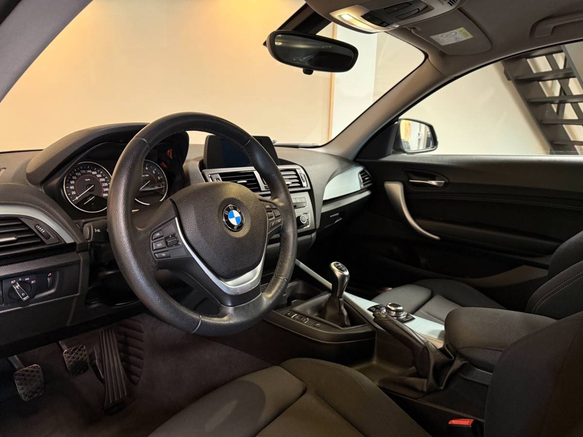 BMW 1 Serie BMW 1-serie 114i EDE Corporate Lease Edition *2de Eigenaar/Dealer OH* Camera|Cruise|Navi|PDC|NAP