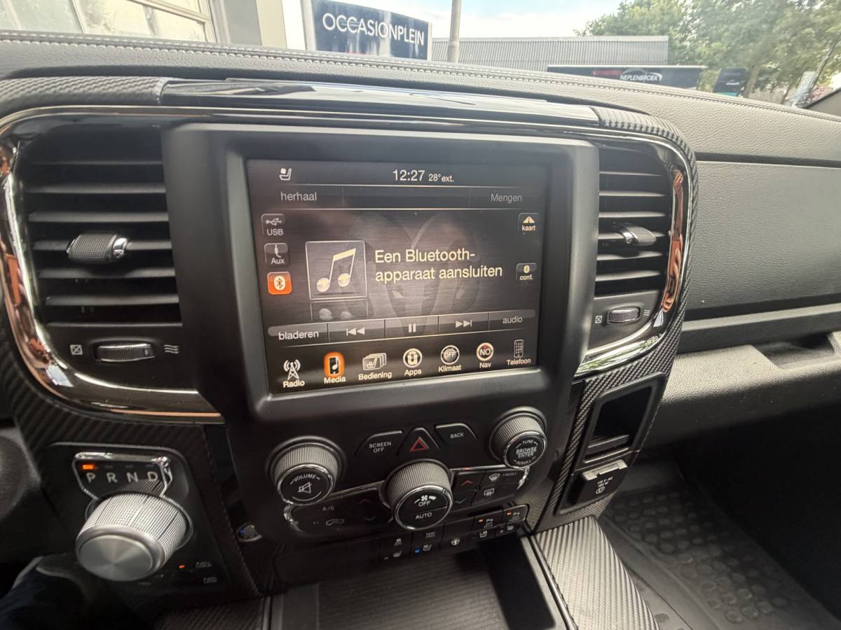 Dodge Ram 1500 Dodge Ram 1500 5.7 V8 4×4 Quad Cab 6’4 Sport 1500 5.7 HEMI V8 4×4 Quad Cab 6’4 Sport | LPG | Schuif/kanteldak | Winterpakket  06-2018 193.725 KM