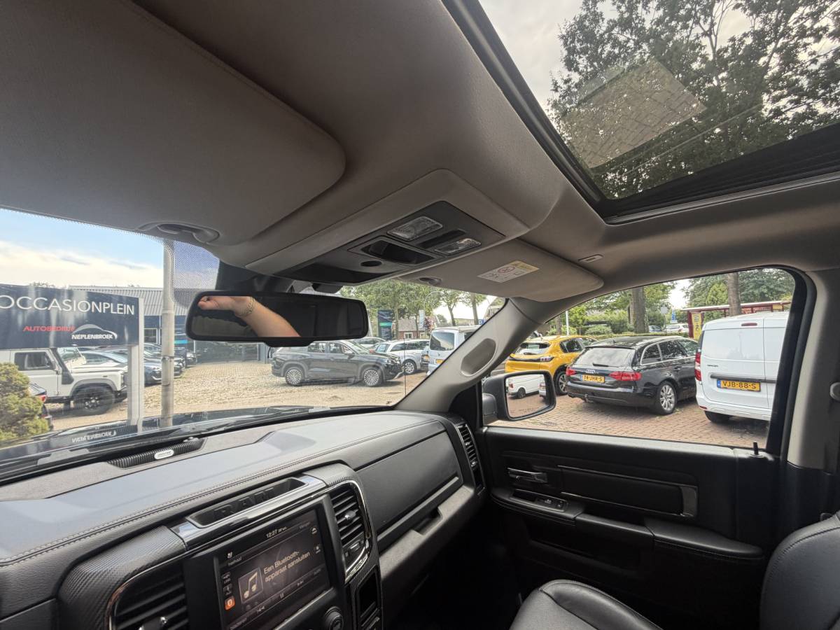 Dodge Ram 1500 Dodge Ram 1500 5.7 V8 4×4 Quad Cab 6’4 Sport 1500 5.7 HEMI V8 4×4 Quad Cab 6’4 Sport | LPG | Schuif/kanteldak | Winterpakket  06-2018 193.725 KM