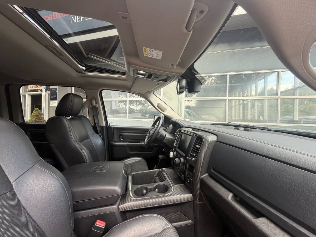 Dodge Ram 1500 Dodge Ram 1500 5.7 V8 4×4 Quad Cab 6’4 Sport 1500 5.7 HEMI V8 4×4 Quad Cab 6’4 Sport | LPG | Schuif/kanteldak | Winterpakket  06-2018 193.725 KM