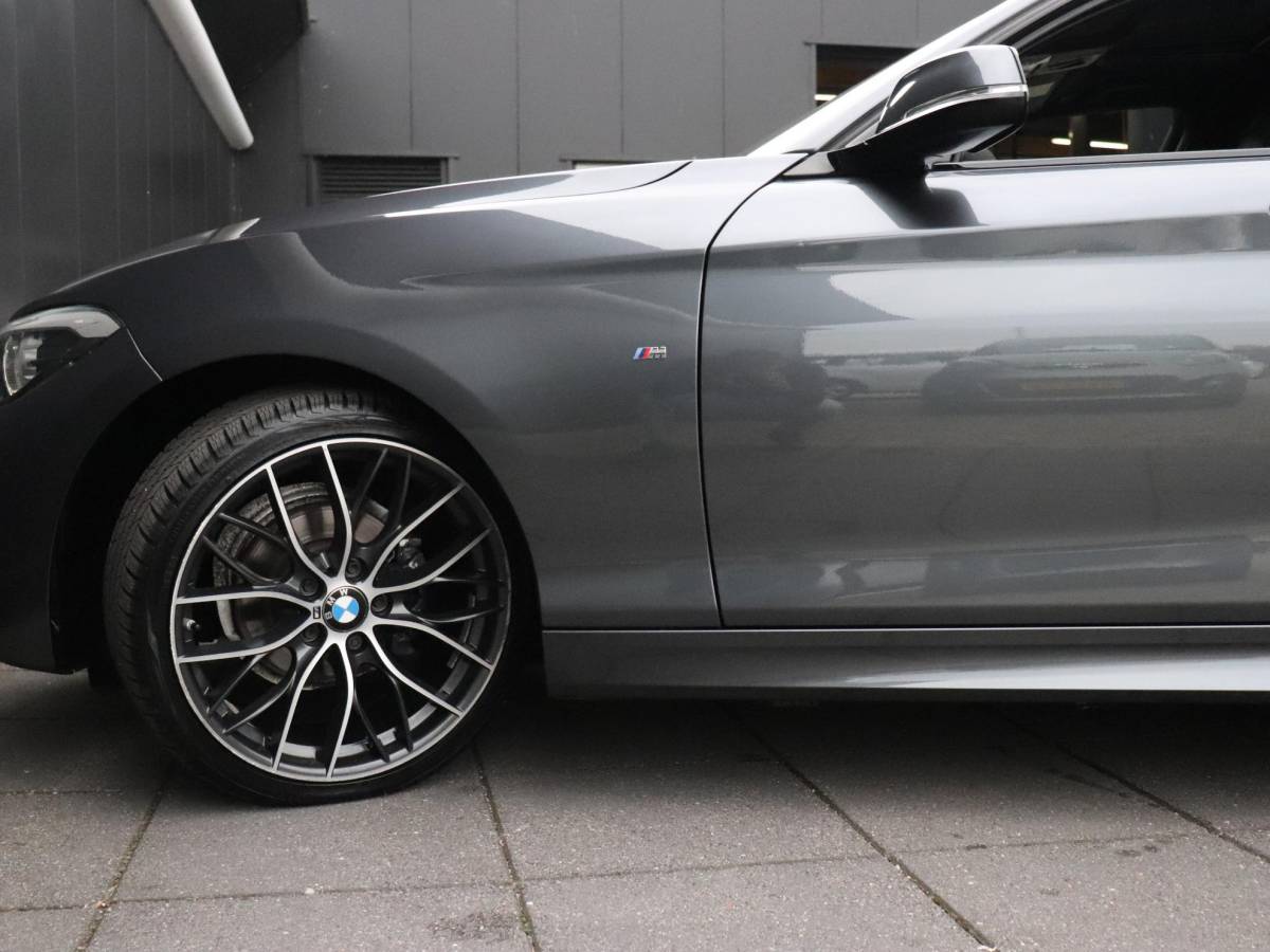 BMW 1 Serie BMW 1-serie 118i High Executive | AUT. | M SPORT | LEDER | SCHUIFDAK | TREKHAAK | PDC | STOELVERW. | CRUISE |