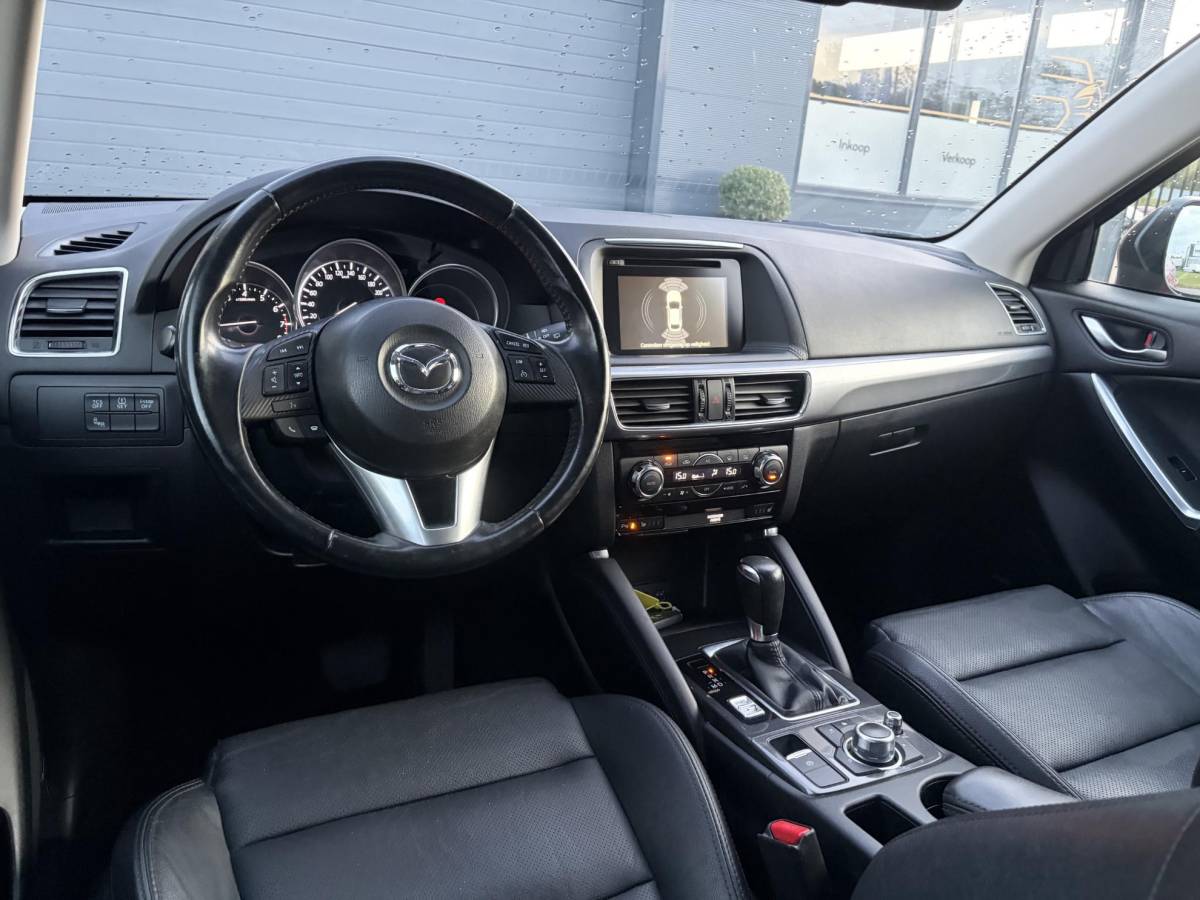 Mazda CX-5 Mazda CX-5 2.0 SkyActiv-G 165 Skylease GT 2WD ✓Recent beurt gehad✓Automaat✓2e Eigenaar✓Camera✓Trekhaak✓Navi✓Leder✓Keyless✓Pdc V+A✓Winterset✓165pk✓Stoelverw✓Elekt Memory Stoelen✓Rijstrooksensor✓Dodehoeksensor✓N.A.P✓Bj 12-2015✓Apk tot 07-2027