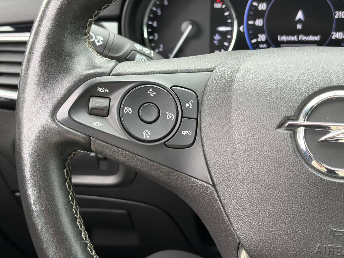 Opel Astra Opel Astra Sports Tourer 1.2 Elegance ✓131pk✓2e Eigenaar✓Camera✓Carplay✓6 Bak✓Stoelverw✓Stuurverw✓Pdc V+A✓Recent beurt gehad✓Clima✓Cruise✓Halfleder✓Keyless✓N.A.P✓Lm velgen✓Rijstrooksensor✓Apk tot 09-2028