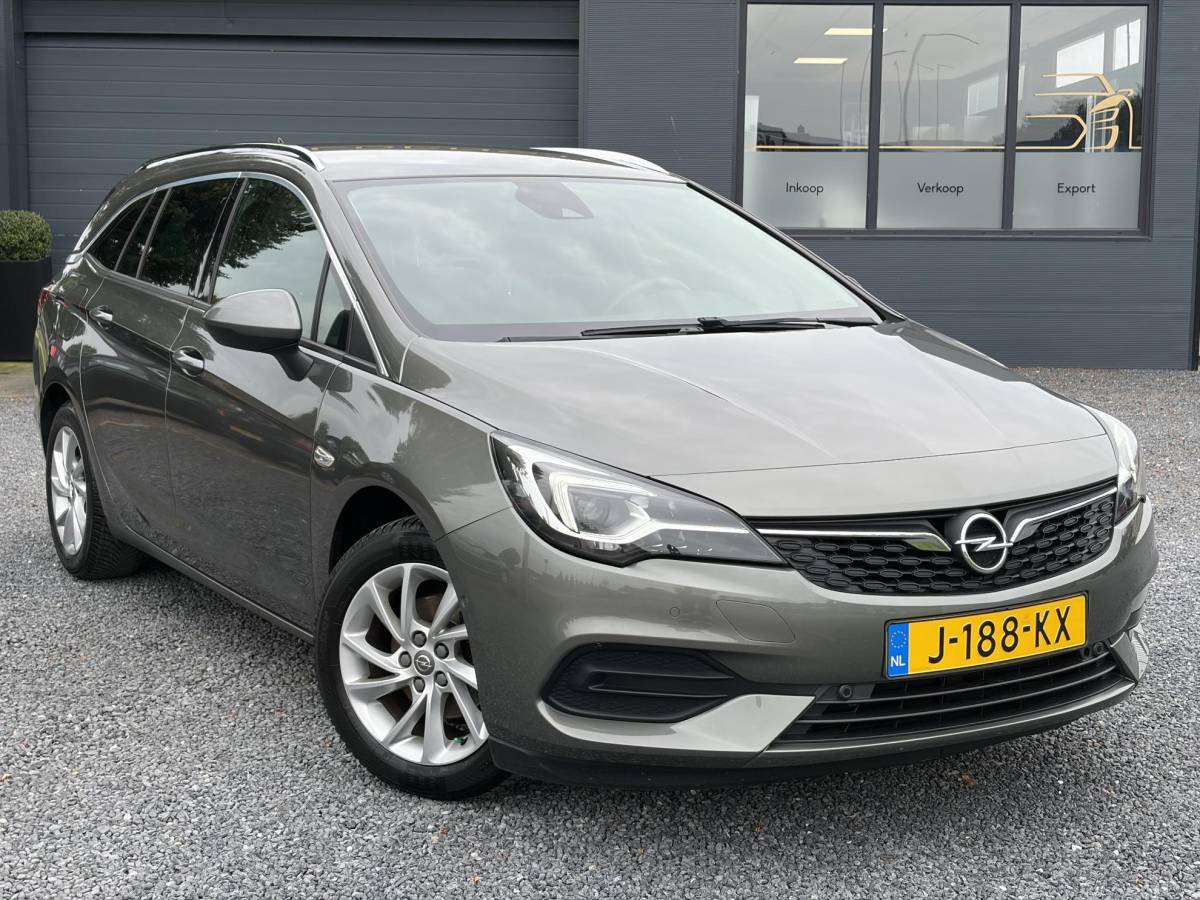 Opel Astra Opel Astra Sports Tourer 1.2 Elegance ✓131pk✓2e Eigenaar✓Camera✓Carplay✓6 Bak✓Stoelverw✓Stuurverw✓Pdc V+A✓Recent beurt gehad✓Clima✓Cruise✓Halfleder✓Keyless✓N.A.P✓Lm velgen✓Rijstrooksensor✓Apk tot 09-2028