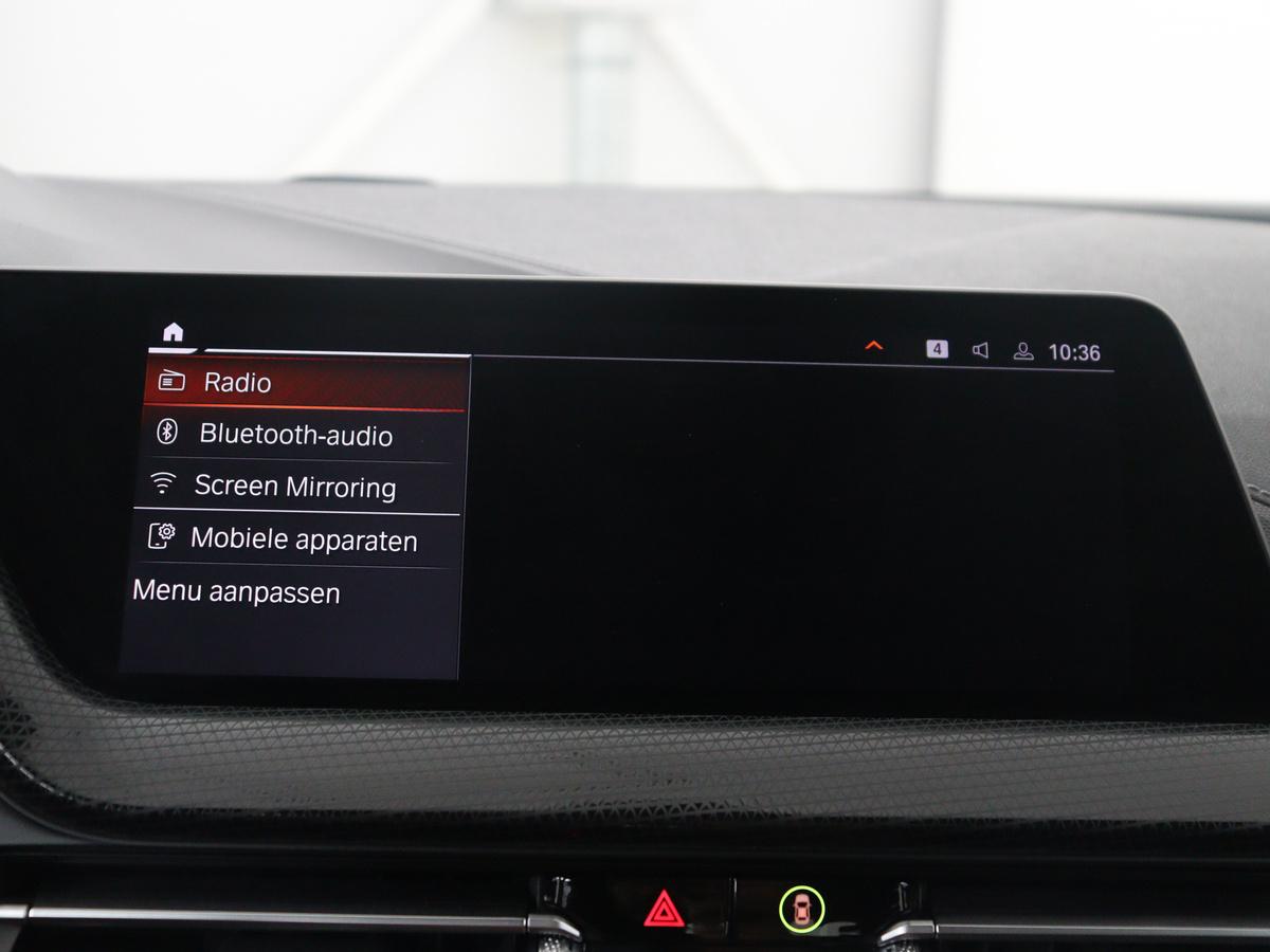 BMW 1 Serie BMW 1-serie 118i Business Edition | Half leder | Cruise control | Stoelverwarming | Navigatie | Carplay | Park assist | Climate control | Virtual dashboard | 17″ velgen