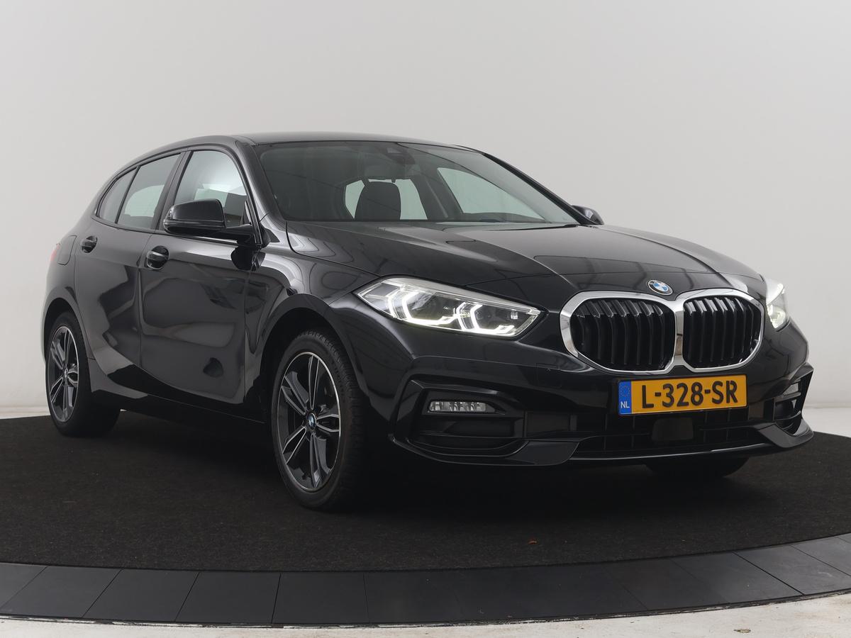 BMW 1 Serie BMW 1-serie 118i Business Edition | Half leder | Cruise control | Stoelverwarming | Navigatie | Carplay | Park assist | Climate control | Virtual dashboard | 17″ velgen