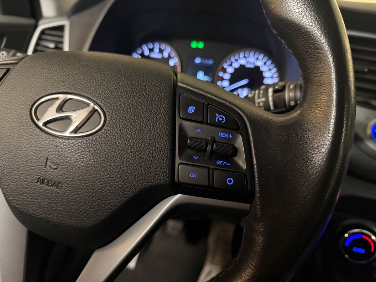 Hyundai Tucson Hyundai Tucson 1.6 GDi Premium *Dealer OH* Stoel/Stuurverw.|Camera|Cruise|Navi|19” Velgen|BT|PDC|Sidebars