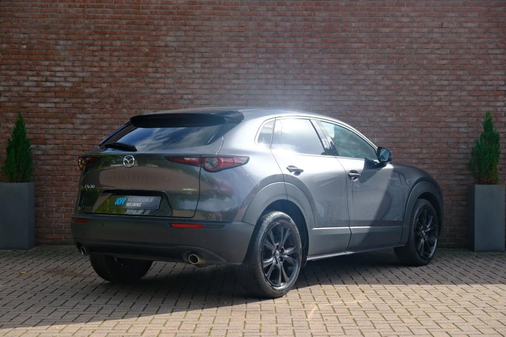 Mazda CX-30 Mazda CX-30 2.5 e-SkyActiv-G M Hybrid 140pk Aut. Nagisa – Head-up display – Bose – Adaptieve cruise – Achteruitrijcamera – Dodehoekdetectie – Stoelverwarming – Elektrische achterklep – Keyless